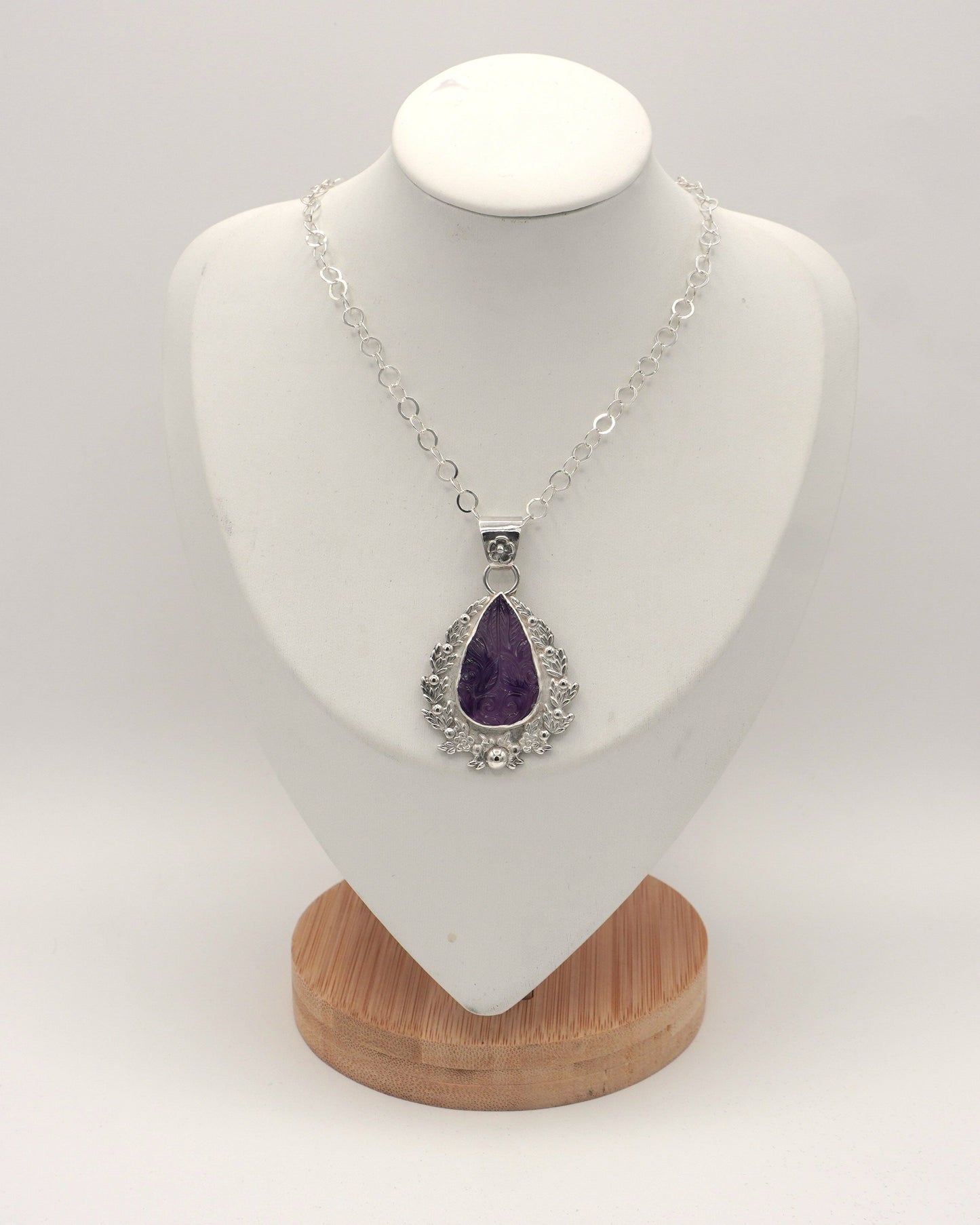 Carved Amethyst Embellished Pendant