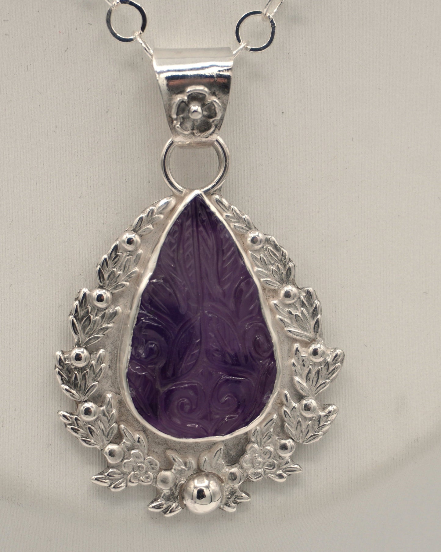 Carved Amethyst Embellished Pendant