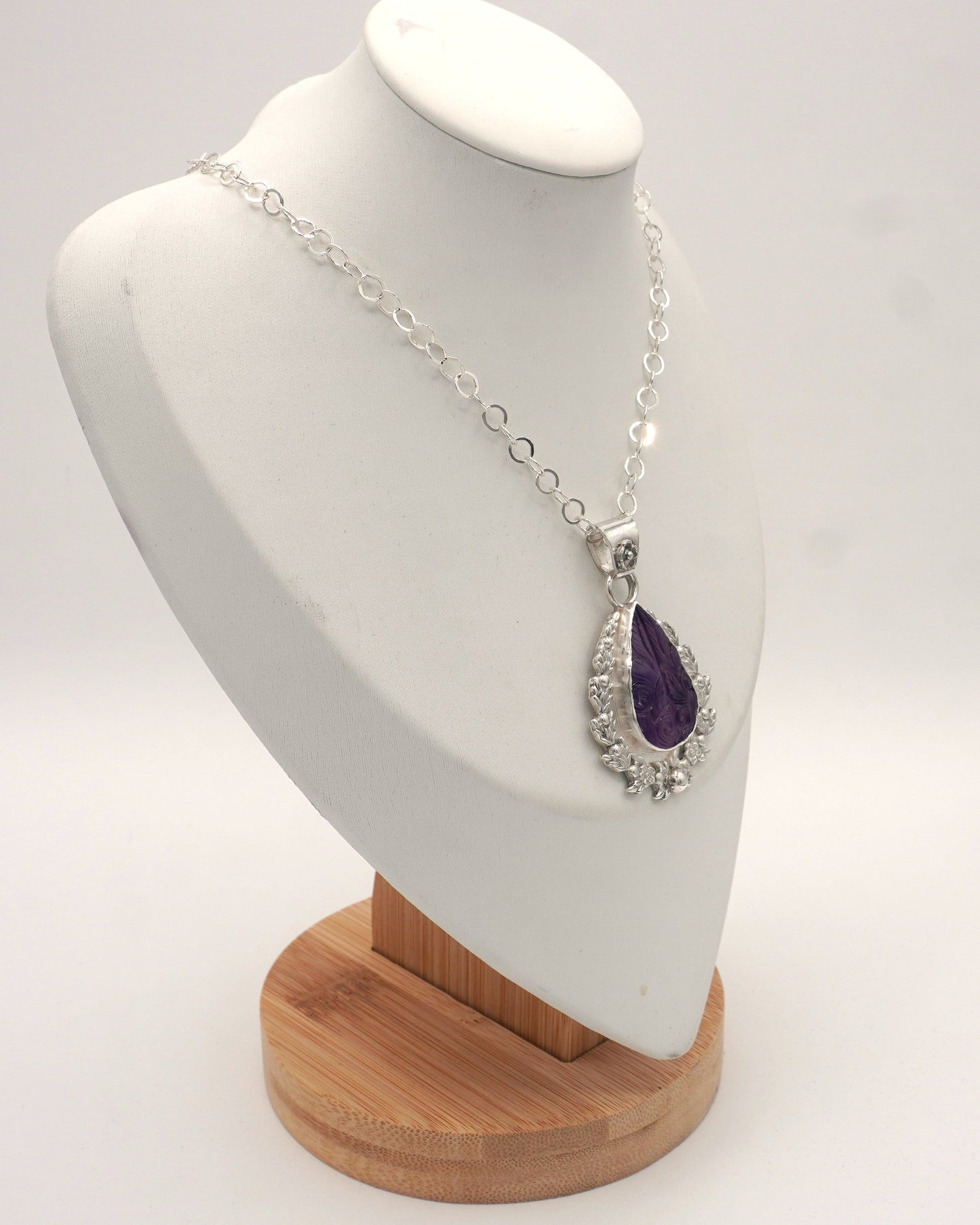 Carved Amethyst Embellished Pendant