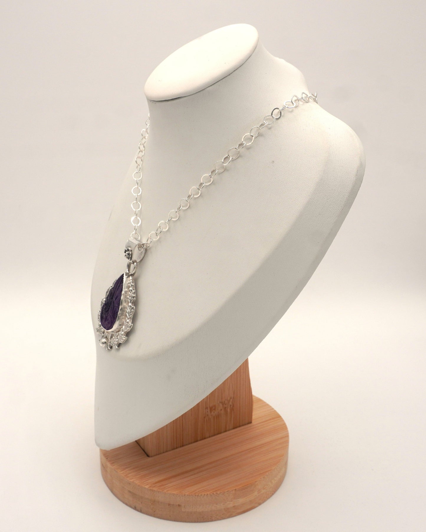 Carved Amethyst Embellished Pendant