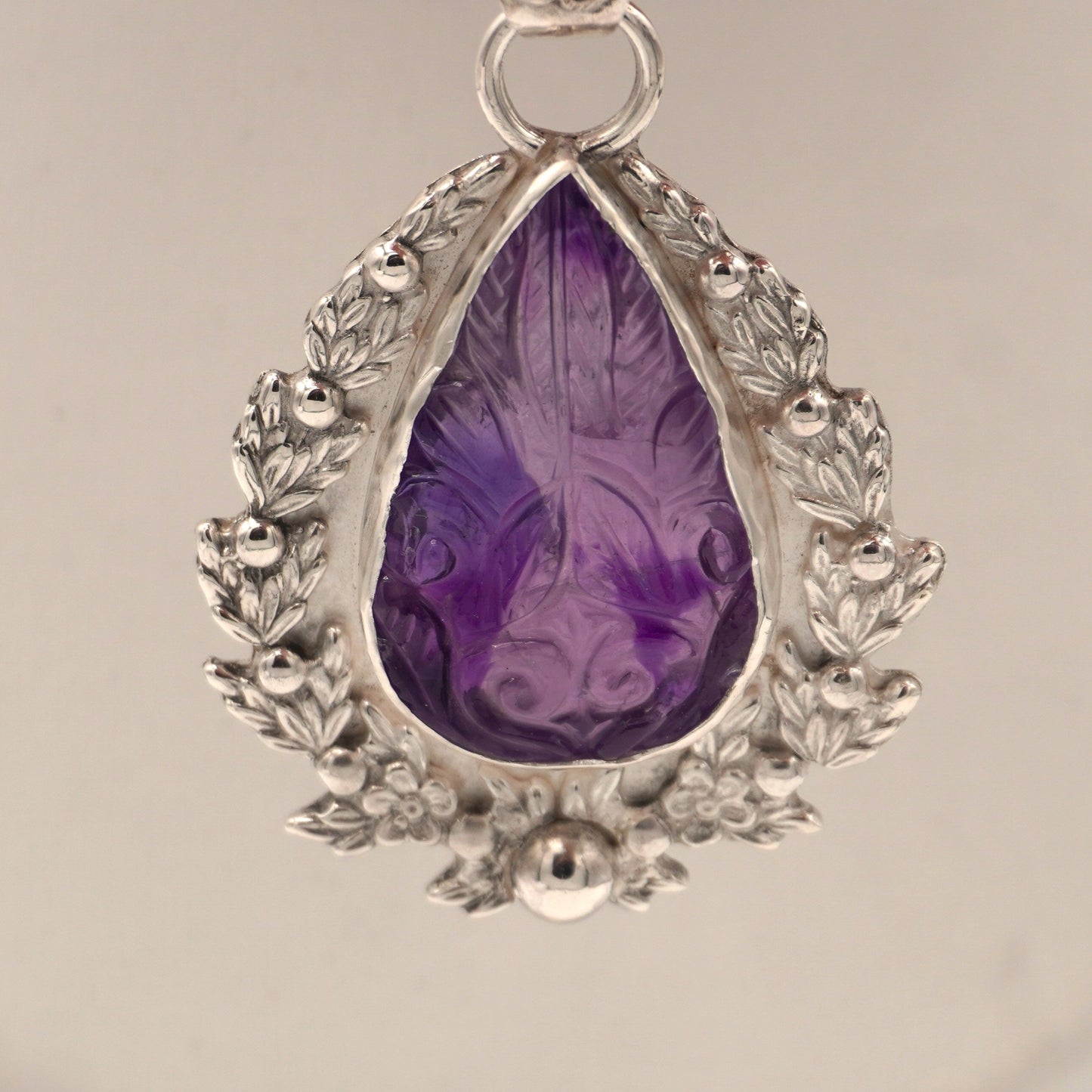 Carved Amethyst Embellished Pendant